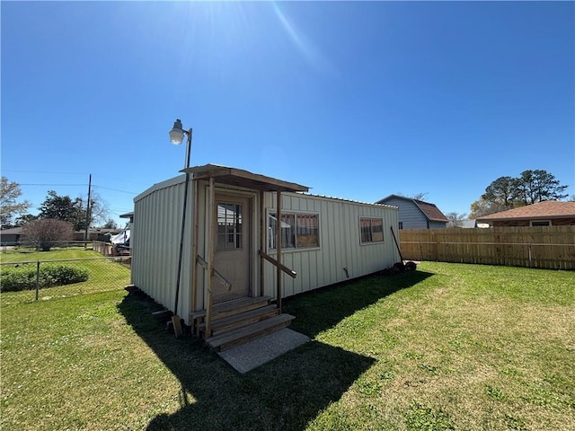 1871 George St, Lutcher, LA 70071 - view of outbuilding featuring fence private yard