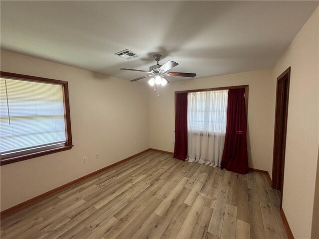 1871 George St, Lutcher, LA 70071 - unfurnished room with visible vents, plenty of natural light, light wood-style floors, and a ceiling fan