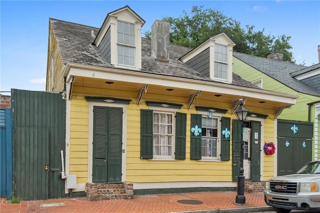 933 Orleans St Unit 4, New Orleans, LA 70116 - view of front of property featuring a chimney and entry steps