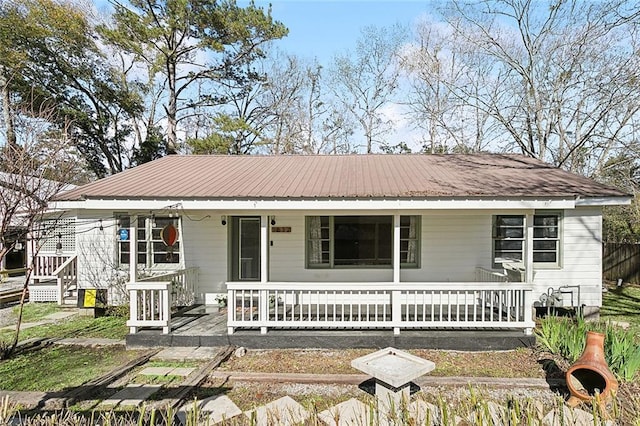 1612 Mossy St, Covington, LA 70433 - view of front of house with metal roof and covered porch
