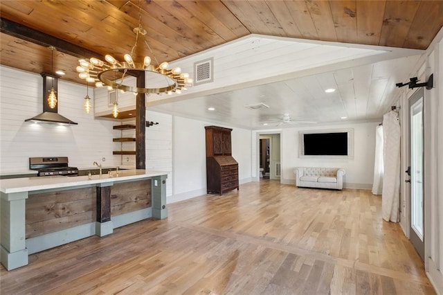 1612 Mossy St, Covington, LA 70433 - kitchen featuring wooden ceiling, wall chimney range hood, gas stove, and visible vents