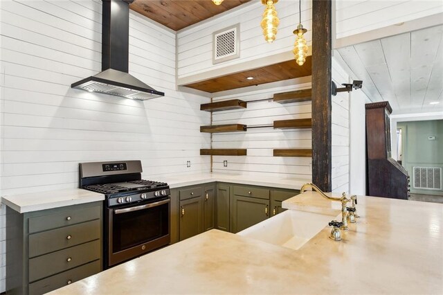 1612 Mossy St, Covington, LA 70433 - kitchen with visible vents, stainless steel range with gas cooktop, open shelves, a sink, and wall chimney exhaust hood