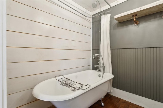 1612 Mossy St, Covington, LA 70433 - full bath featuring a freestanding tub, a shower with curtain, wood finished floors, and wood walls