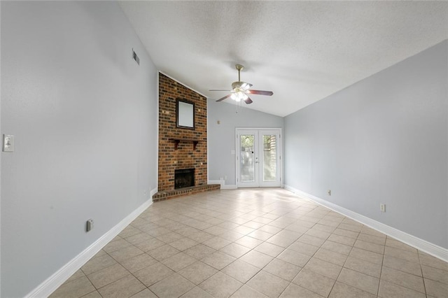302 Bogie Dr Unit 25D, Slidell, LA 70460 - unfurnished living room with vaulted ceiling, ceiling fan, a textured ceiling, light tile patterned floors, and a brick fireplace