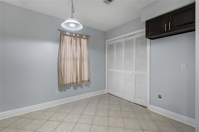 302 Bogie Dr Unit 25D, Slidell, LA 70460 - unfurnished dining area featuring baseboards and light tile patterned floors