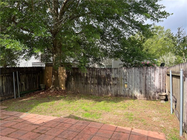 302 Bogie Dr Unit 25D, Slidell, LA 70460 - fenced backyard featuring a patio area