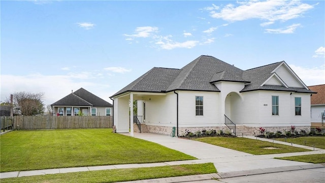 8520 Creole Dr, Chalmette, LA 70043 - view of front facade with roof with shingles, a front yard, and fence