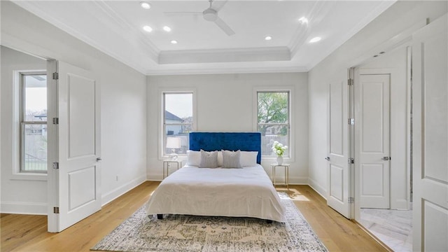 8520 Creole Dr, Chalmette, LA 70043 - bedroom featuring light wood finished floors, a raised ceiling, baseboards, and ornamental molding