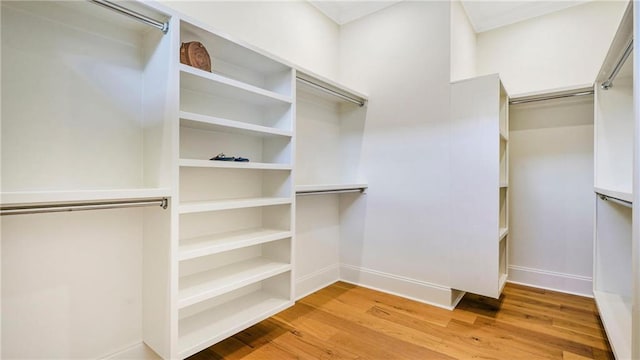 8520 Creole Dr, Chalmette, LA 70043 - walk in closet with wood finished floors