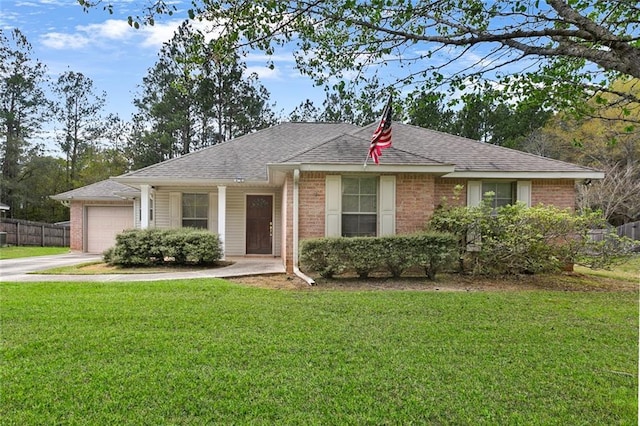 ranch-style home featuring fence, an attached garage, concrete driveway, brick siding, and a front lawn
