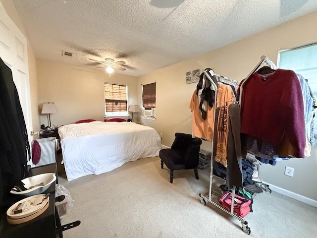 5930 Louisville St, New Orleans, LA 70124 - carpeted bedroom featuring visible vents, baseboards, cooling unit, a textured ceiling, and a ceiling fan