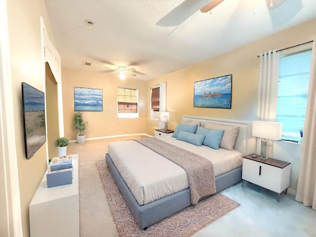 5930 Louisville St, New Orleans, LA 70124 - bedroom featuring light carpet, baseboards, visible vents, and ceiling fan