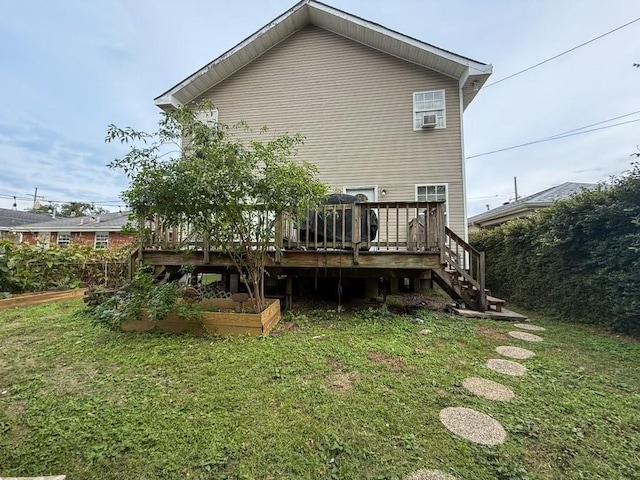 5930 Louisville St, New Orleans, LA 70124 - back of house featuring a deck, a yard, cooling unit, a vegetable garden, and stairs