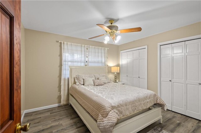 8221 Saro Ln, Saint Bernard, LA 70085 - bedroom with multiple closets, wood finished floors, baseboards, and a ceiling fan