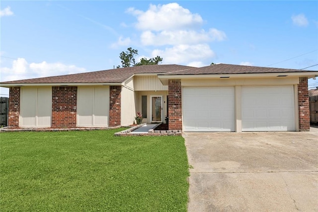 view of front of home featuring concrete driveway, brick siding, and a front yard