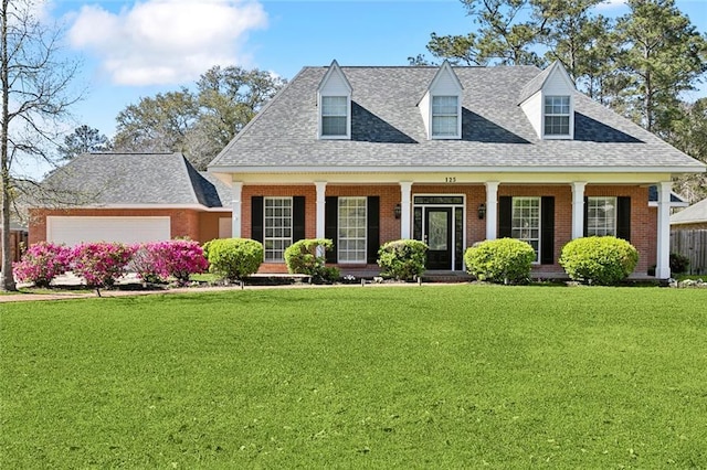 cape cod-style house with a front lawn, brick siding, and roof with shingles