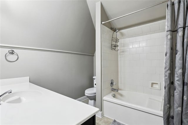 bathroom with baseboards, shower / tub combo with curtain, vanity, and toilet