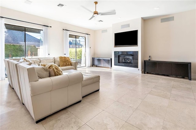 5878 General Haig St, New Orleans, LA 70124 - living room featuring a ceiling fan, a glass covered fireplace, and recessed lighting