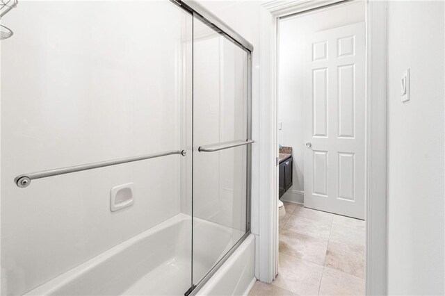 5878 General Haig St, New Orleans, LA 70124 - bathroom with enclosed tub / shower combo and tile patterned floors