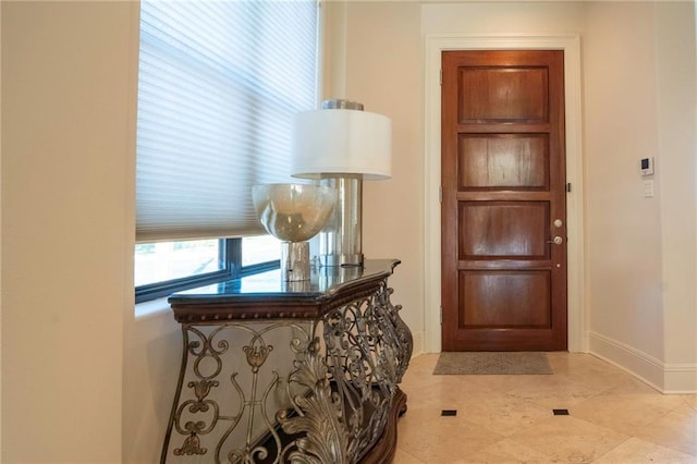 5878 General Haig St, New Orleans, LA 70124 - foyer featuring baseboards and light tile patterned floors