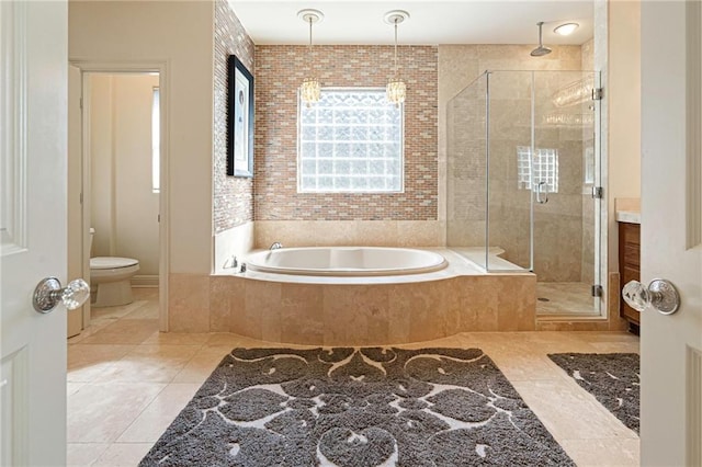 5878 General Haig St, New Orleans, LA 70124 - full bathroom featuring a bath, a stall shower, and tile patterned flooring