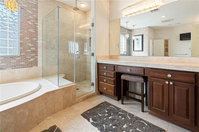 5878 General Haig St, New Orleans, LA 70124 - full bathroom featuring tile patterned flooring, a stall shower, a garden tub, and vanity