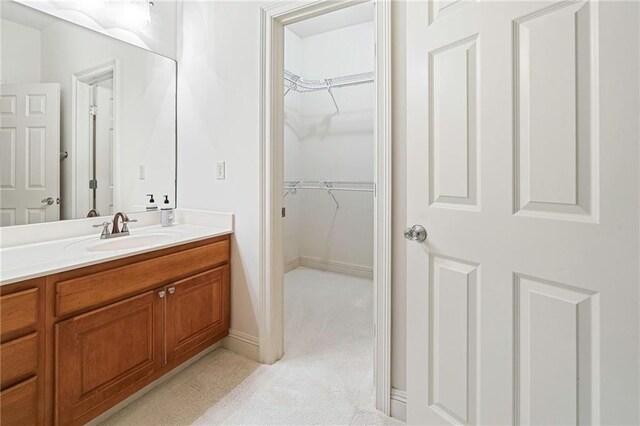 5878 General Haig St, New Orleans, LA 70124 - bathroom featuring vanity and a spacious closet