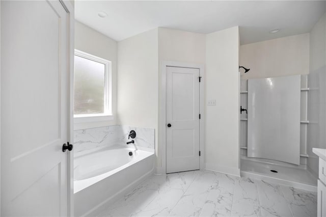 full bath featuring a bath, marble finish floor, and a walk in shower