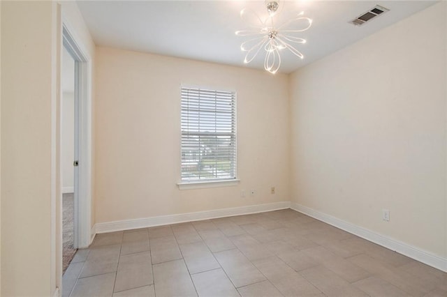 unfurnished room with an inviting chandelier, baseboards, and visible vents