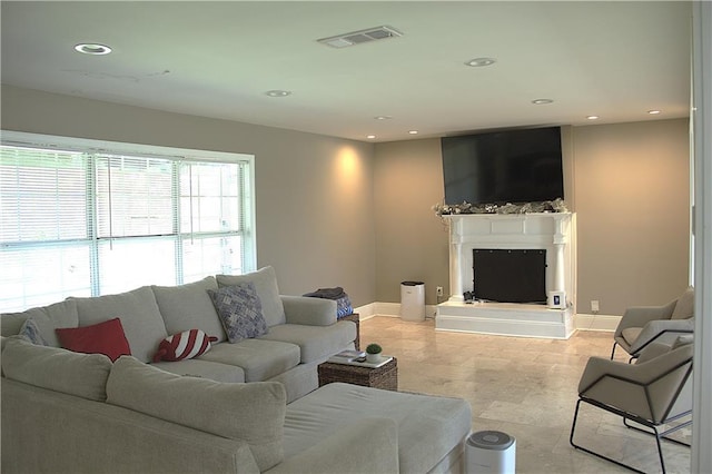 4043 S Pin Oak Ave, New Orleans, LA 70131 - living room with recessed lighting, visible vents, baseboards, and a fireplace with raised hearth