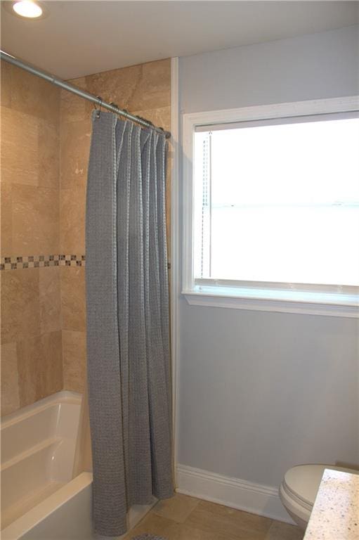 4043 S Pin Oak Ave, New Orleans, LA 70131 - full bath with toilet, baseboards, and shower / bath combo with shower curtain