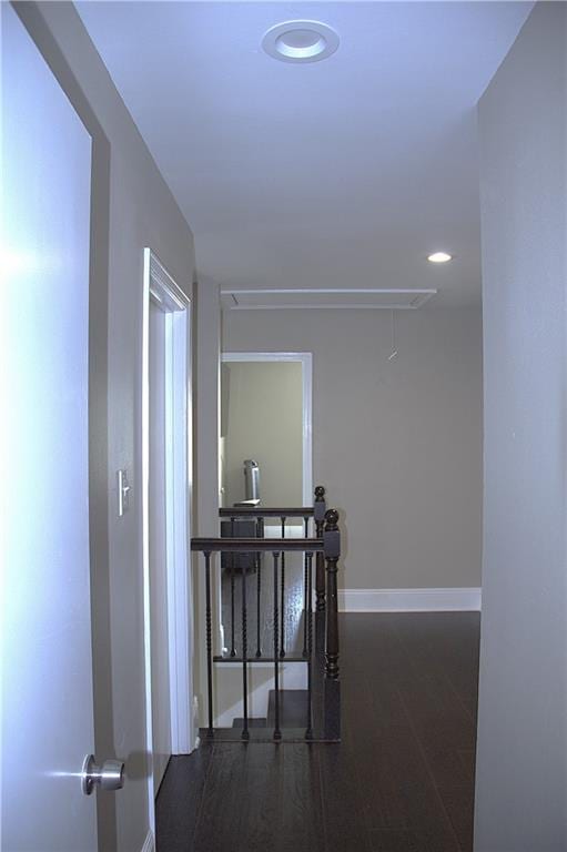 4043 S Pin Oak Ave, New Orleans, LA 70131 - corridor featuring wood finished floors, baseboards, attic access, recessed lighting, and an upstairs landing