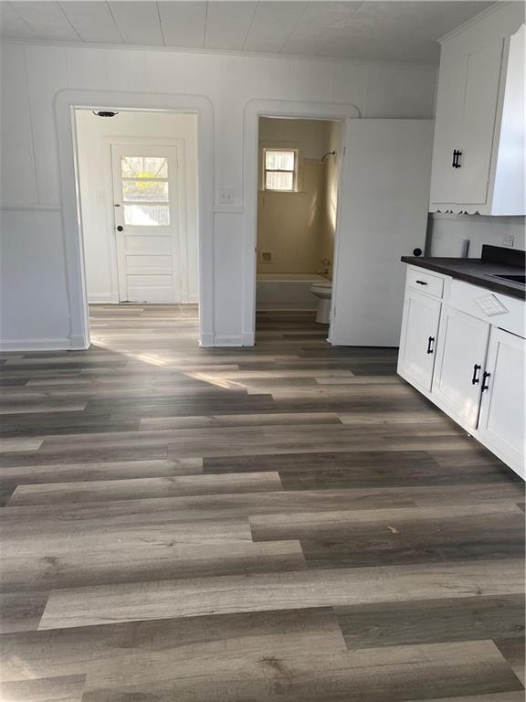 512 Fos Ave, Marrero, LA 70058 - kitchen with plenty of natural light, dark countertops, and white cabinets