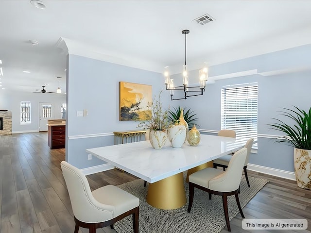 dining room featuring baseboards, visible vents, and dark wood-style flooring