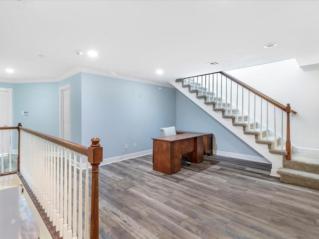 unfurnished office with baseboards, wood finished floors, recessed lighting, and ornamental molding