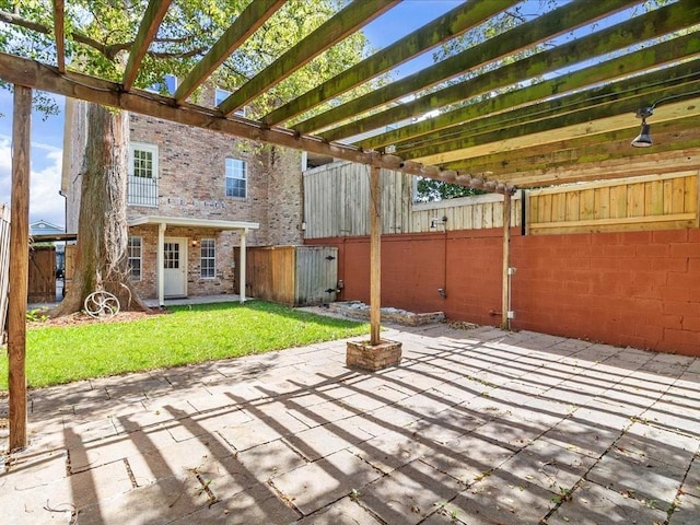 view of patio / terrace featuring a pergola and fence
