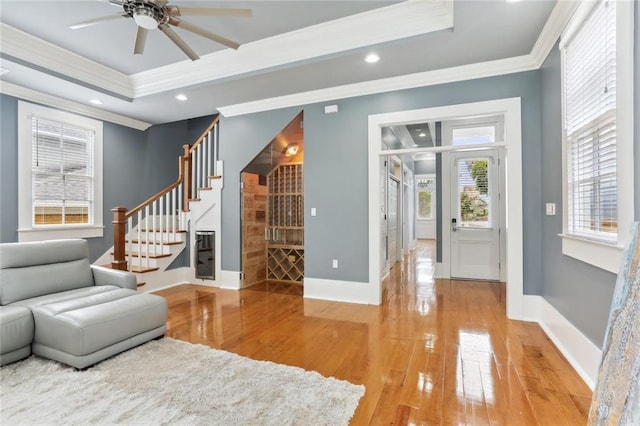 736 Belleville St, New Orleans, LA 70114 - sitting room with ornamental molding, stairs, light wood-style floors, ceiling fan, and recessed lighting