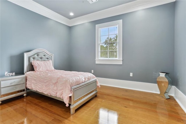 736 Belleville St, New Orleans, LA 70114 - bedroom featuring ornamental molding, baseboards, wood finished floors, and recessed lighting