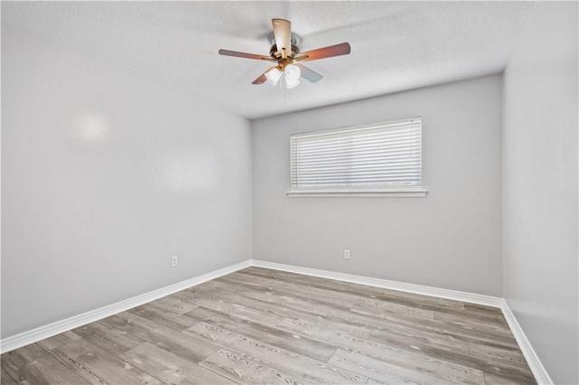 1558 Monaco Dr, Slidell, LA 70458 - unfurnished room featuring ceiling fan, wood finished floors, baseboards, and a textured ceiling