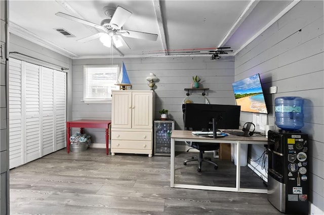office with visible vents, wood finished floors, and a ceiling fan