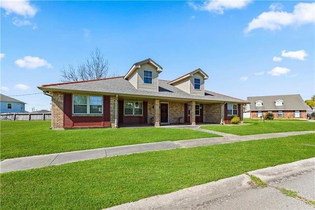 2828 Jean Lafitte Pkwy, Chalmette, LA 70043 - view of front of property featuring brick siding, a front yard, and roof with shingles