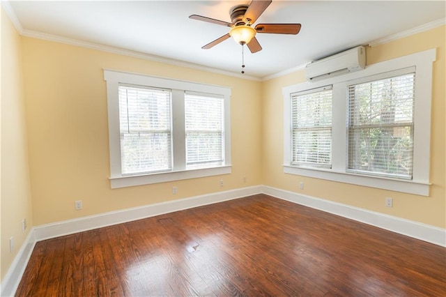 empty room featuring plenty of natural light, dark wood finished floors, crown molding, and a wall mounted AC