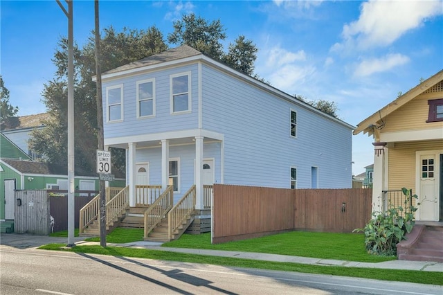 view of front facade featuring fence