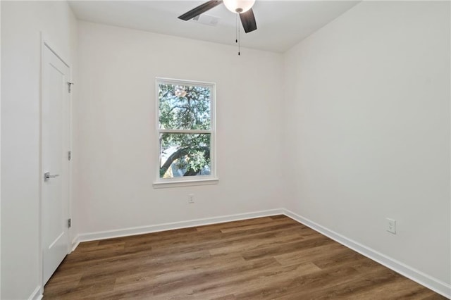 unfurnished bedroom with a ceiling fan, baseboards, and wood finished floors
