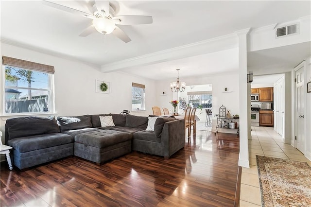 6720 Argonne Boulevard ., New Orleans, LA 70124 - living area featuring visible vents, light wood-style floors, ceiling fan with notable chandelier, and a wealth of natural light