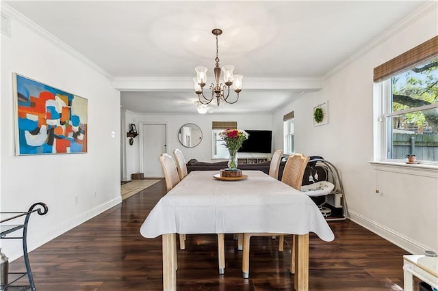 6720 Argonne Boulevard ., New Orleans, LA 70124 - dining area featuring crown molding, baseboards, a notable chandelier, and wood finished floors