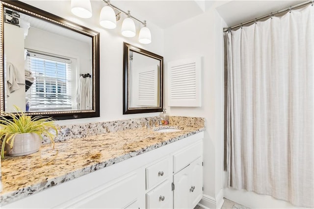 6720 Argonne Boulevard ., New Orleans, LA 70124 - bathroom featuring vanity and shower / tub combo with curtain