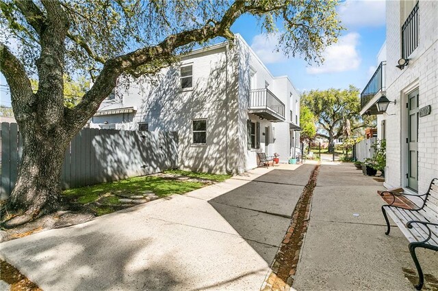 6720 Argonne Boulevard ., New Orleans, LA 70124 - exterior space with fence, a residential view, a patio, and a balcony