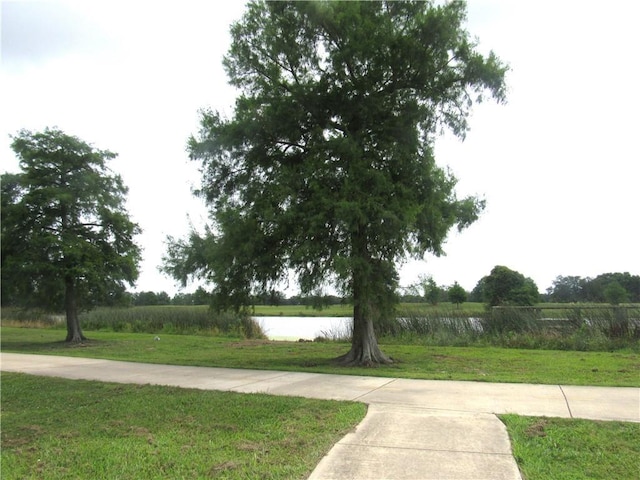 6720 Argonne Boulevard ., New Orleans, LA 70124 - view of home's community with a water view and a yard