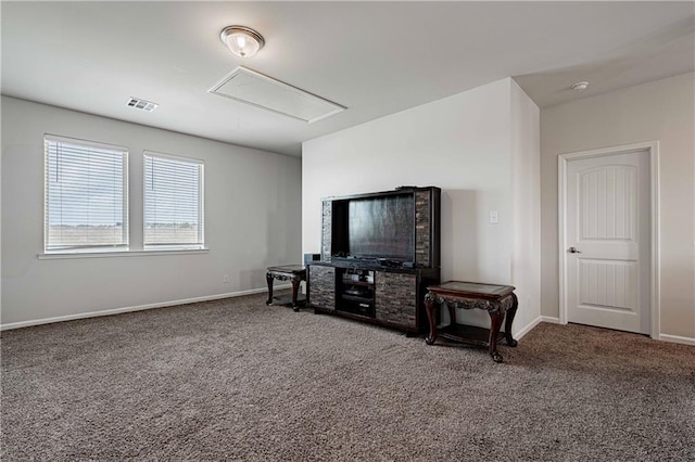 carpeted living room with attic access, baseboards, and visible vents